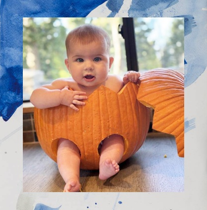 A Cute Photo of a Baby inside a pumpkin